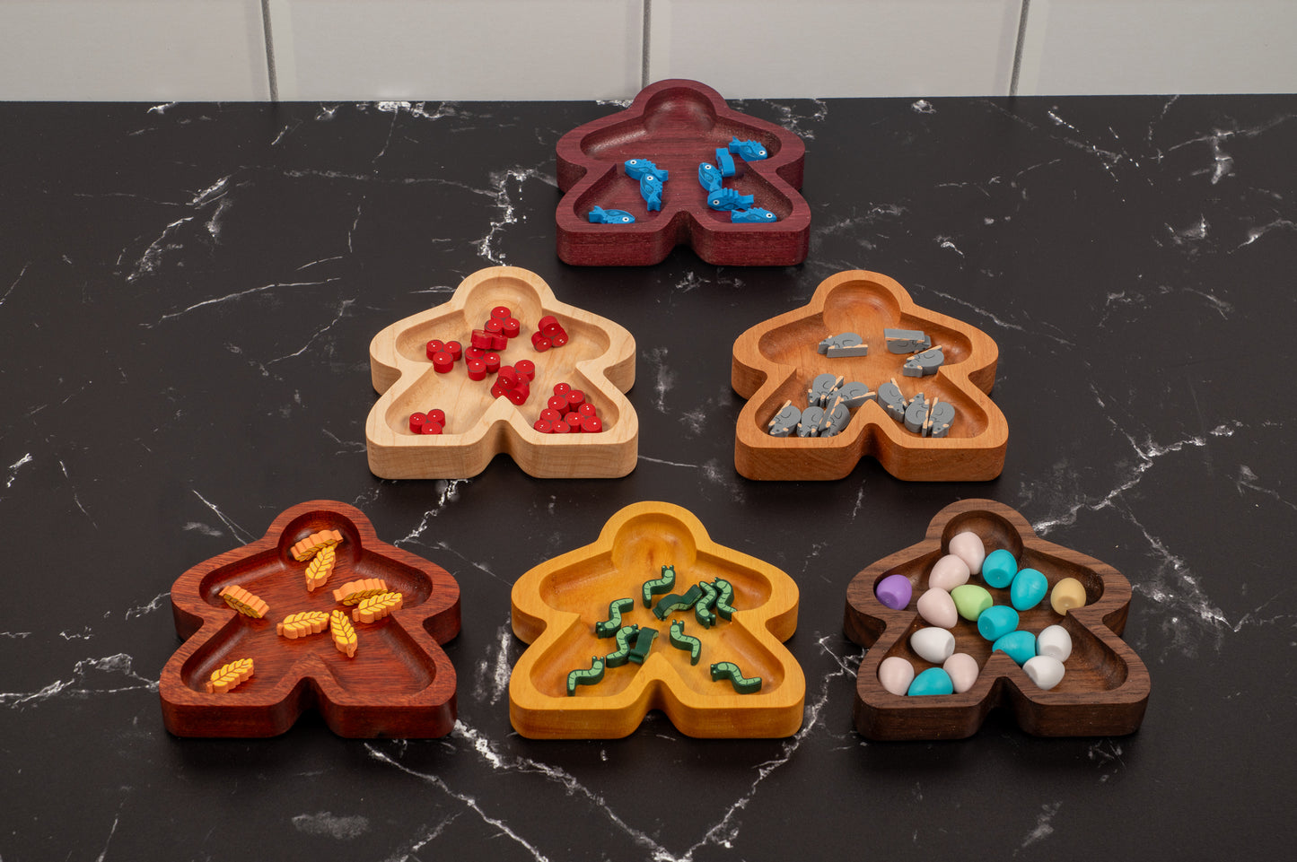 Hardwood Meeple shaped gaming component trays